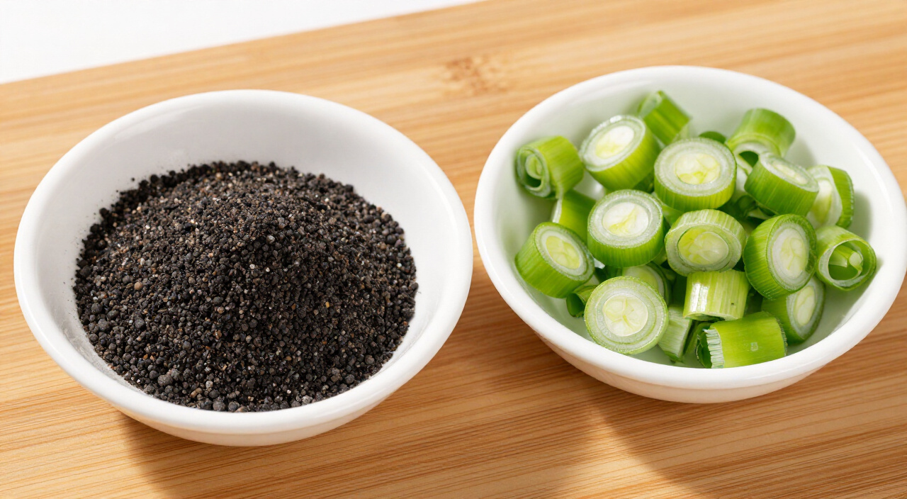 Freshly ground black pepper and sliced green onions in bowls on a wooden board
